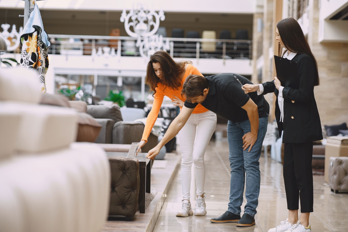 couple-with-salesman-furniture-store